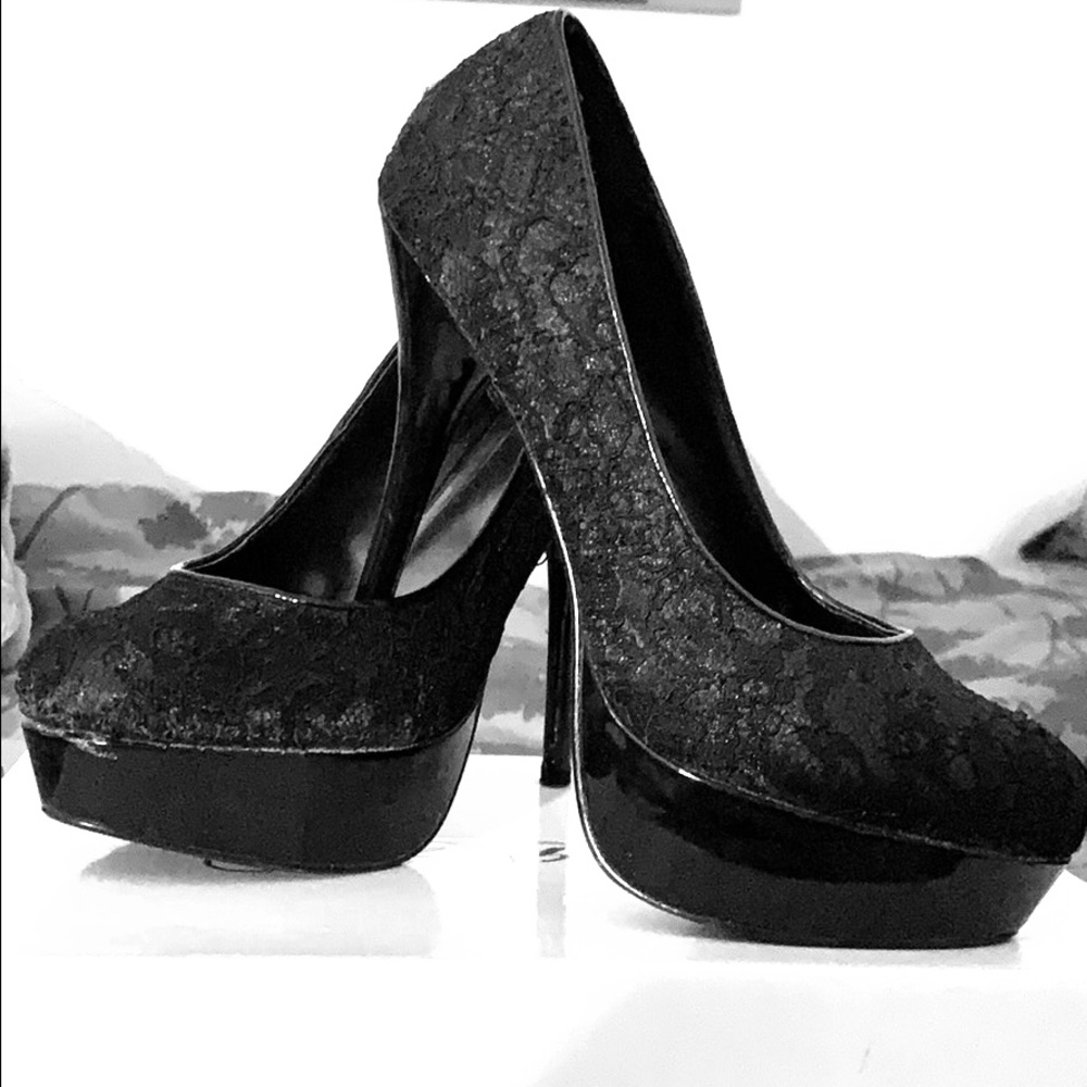 Black heels. Pretty high, skinny heel.